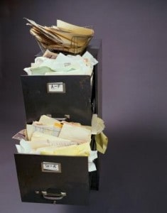 Filing cabinet with an open drawer Metalogix Archive Manager improves search and recovery at the email and mailbox level